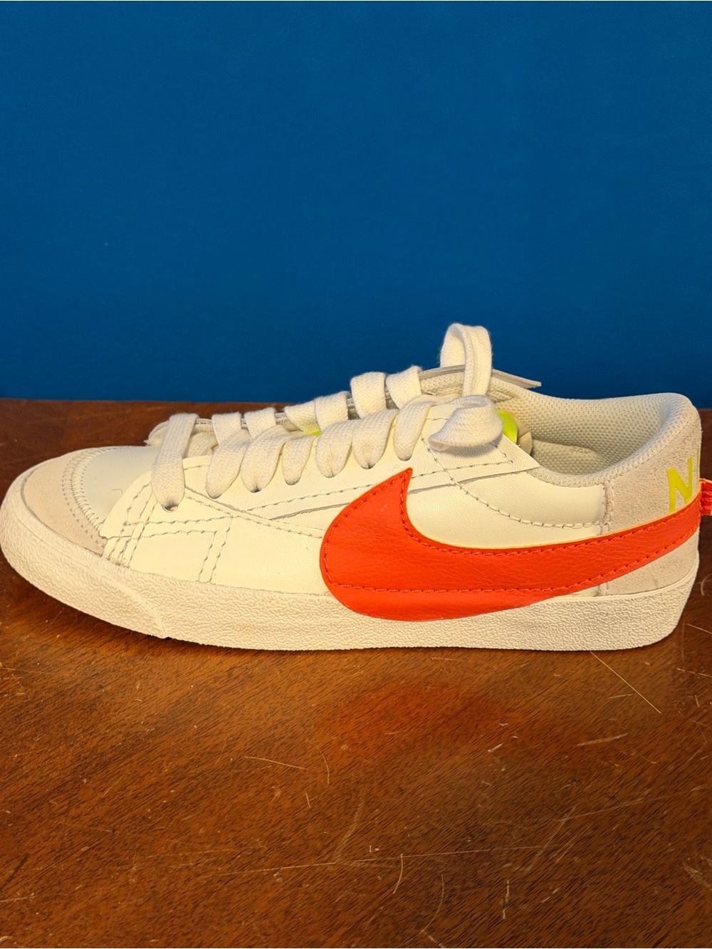 Nike Adult White Sneakers with Orange Swoosh and Neon Yellow Accent